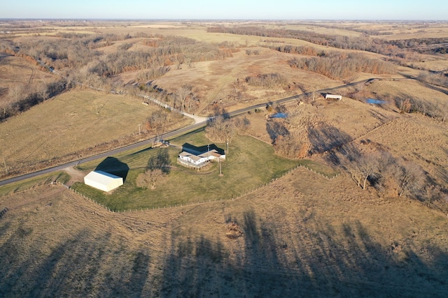 birds eye view of property featuring a rural view