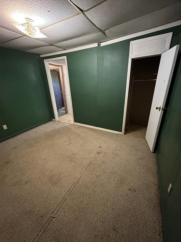 803 Coates St, Macon, MO 63552 - interior space with a drop ceiling, carpet, and a closet