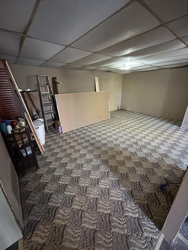 803 Coates St, Macon, MO 63552 - finished basement with carpet and a paneled ceiling