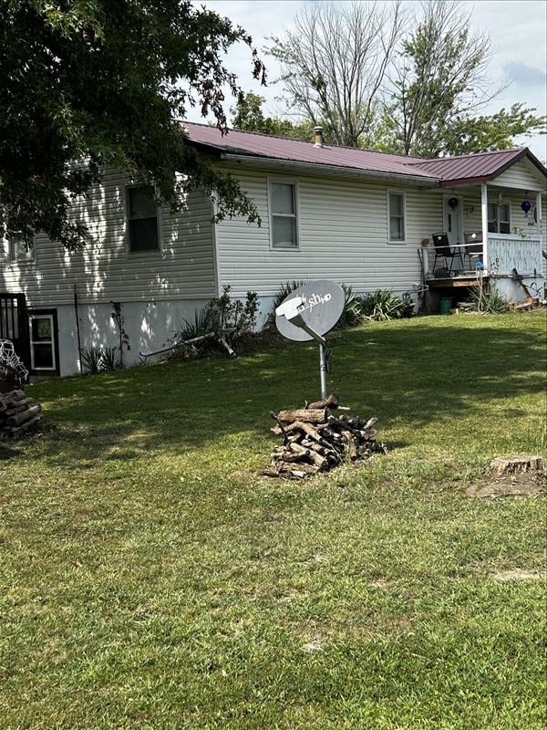 803 Coates St, Macon, MO 63552 - back of house featuring covered porch and a yard