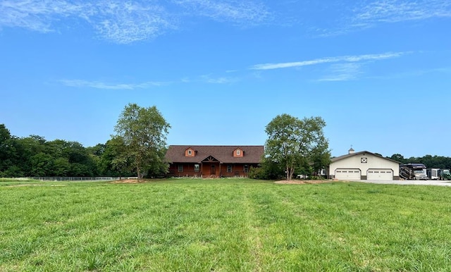 view of front of home with a garage and a front yard