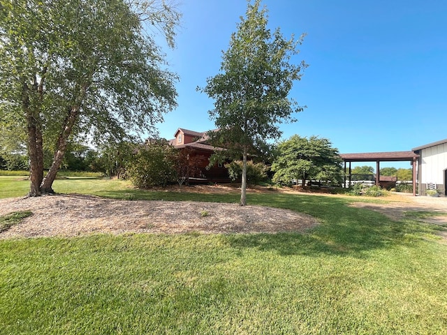 view of yard featuring an attached carport