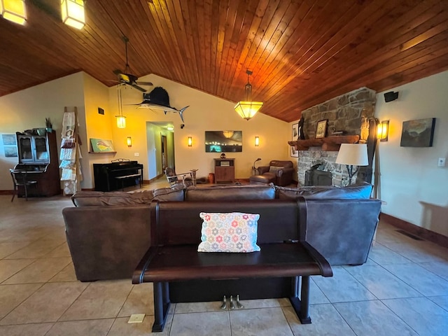 living area with light tile patterned floors, lofted ceiling, wood ceiling, ceiling fan, and a fireplace