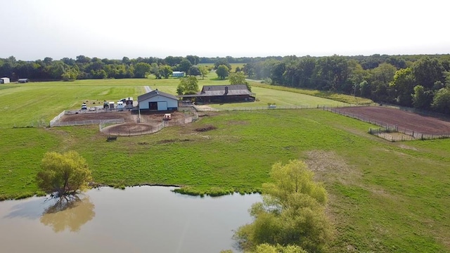 birds eye view of property with a water view and a rural view