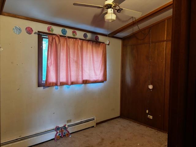 26462 Haven Way, Kirksville, MO 63501 - unfurnished room with a baseboard heating unit, a ceiling fan, light colored carpet, and vaulted ceiling