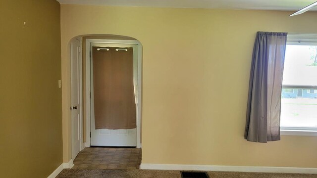 1408 S Downing, Kirksville, MO 63501 - empty room featuring arched walkways and baseboards