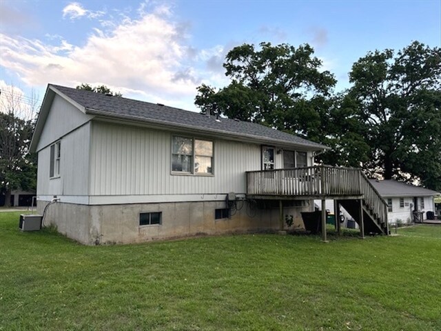 1201 Maffry St, Macon, MO 63552 - back of house with a wooden deck, stairs, a yard, and central AC