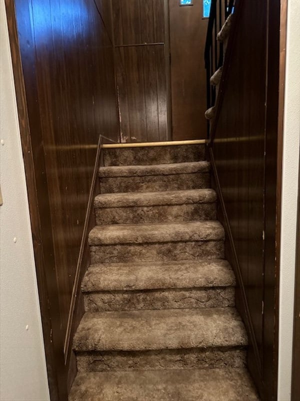 1201 Maffry St, Macon, MO 63552 - stairway featuring wooden walls