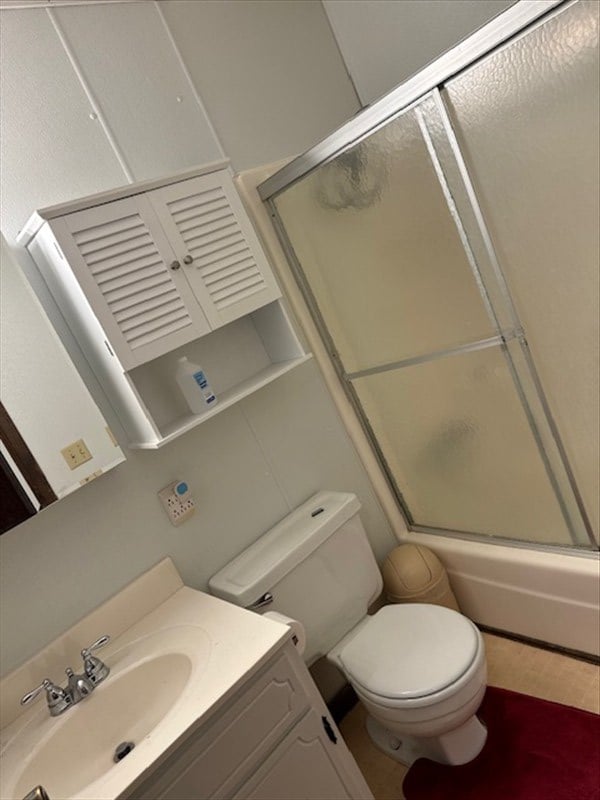 1201 Maffry St, Macon, MO 63552 - full bath with toilet, vanity, and shower / bath combination with glass door