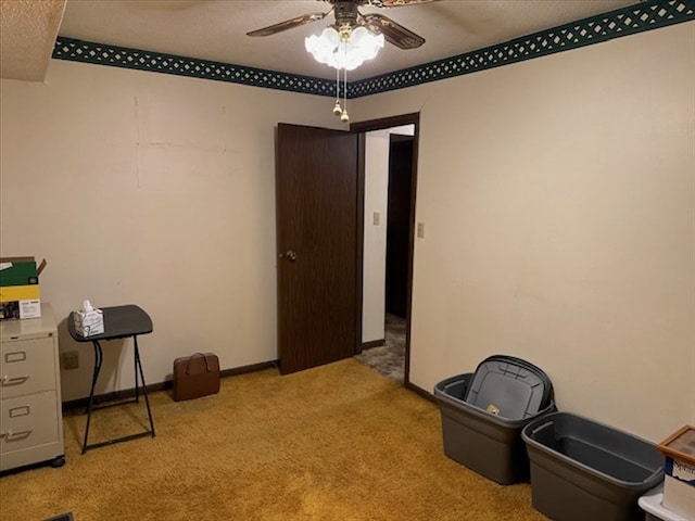 1201 Maffry St, Macon, MO 63552 - miscellaneous room featuring carpet flooring, a ceiling fan, and baseboards