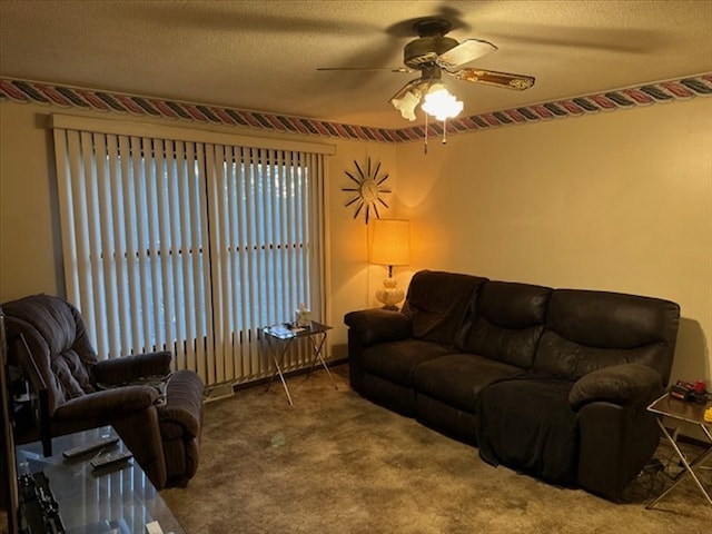 1201 Maffry St, Macon, MO 63552 - living room with a ceiling fan, carpet flooring, and a textured ceiling