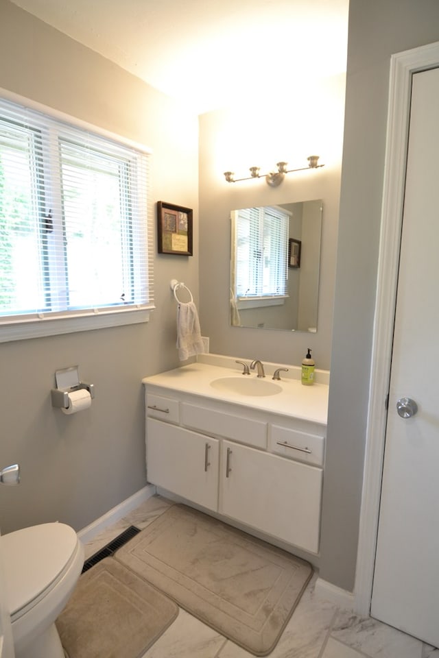 26672 Spring Lake Trl, Kirksville, MO 63501 - bathroom with marble finish flooring, vanity, toilet, and baseboards