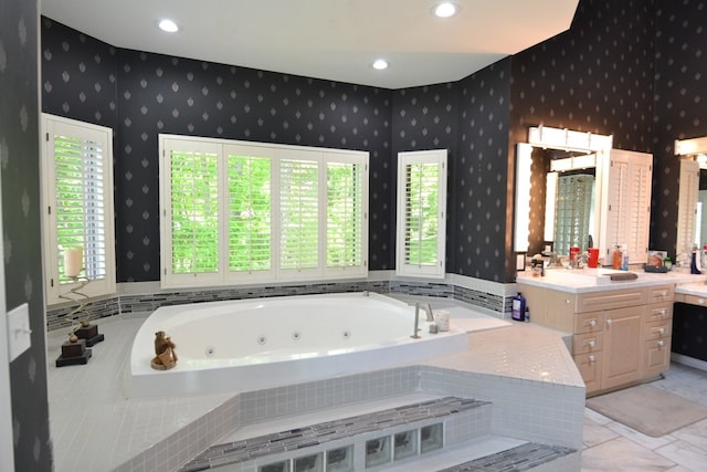 26672 Spring Lake Trl, Kirksville, MO 63501 - bathroom with vanity, a whirlpool tub, wallpapered walls, plenty of natural light, and recessed lighting