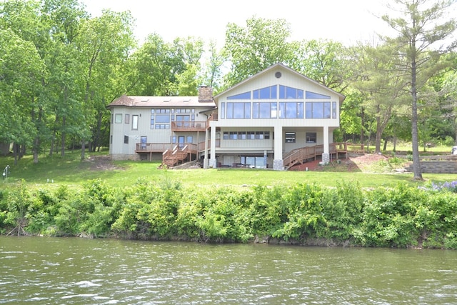 26672 Spring Lake Trl, Kirksville, MO 63501 - rear view of property featuring stairs, a sunroom, a chimney, a deck with water view, and view of wooded area