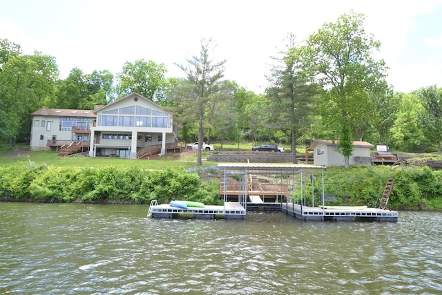 26672 Spring Lake Trl, Kirksville, MO 63501 - dock area featuring a water view, stairway, and view of wooded area