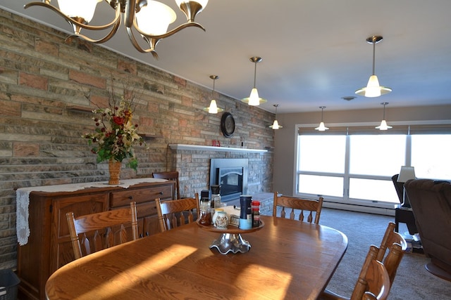 dining room with a notable chandelier, carpet floors, and a baseboard radiator