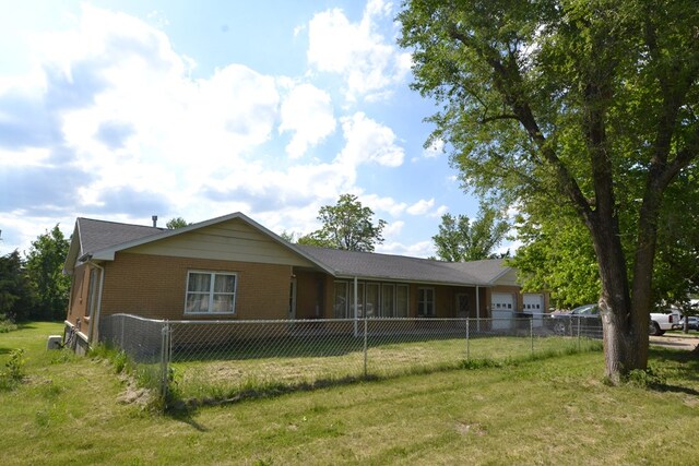 1719 N Osteopathy, Kirksville, MO 63501 - view of front of home featuring an attached garage and brick siding