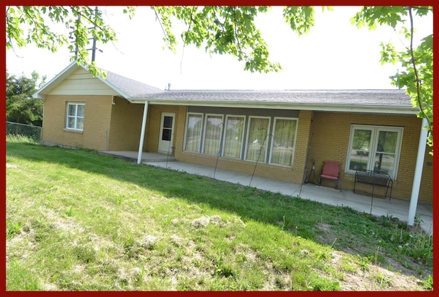 1719 N Osteopathy, Kirksville, MO 63501 - back of property featuring a patio and brick siding