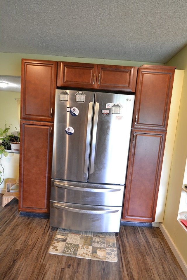 1719 N Osteopathy, Kirksville, MO 63501 - kitchen view of freestanding refrigerator, dark wood-type flooring, and a textured ceiling