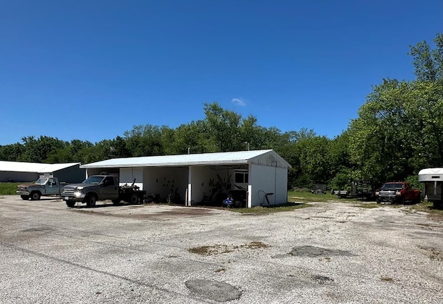 0 State St, Brookfield, MO 64628 - view of parking / parking lot with a carport
