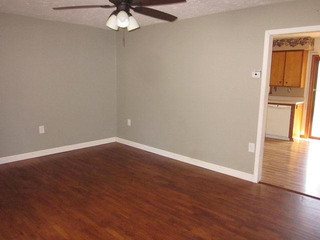 1404 E Washington St, Kirksville, MO 63501 - empty room featuring ceiling fan, baseboards, and wood finished floors