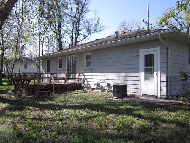 1404 E Washington St, Kirksville, MO 63501 - back of property featuring central AC unit and a deck