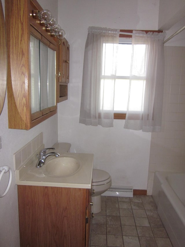 1404 E Washington St, Kirksville, MO 63501 - bathroom featuring a baseboard radiator, toilet, vanity, and bathtub / shower combination