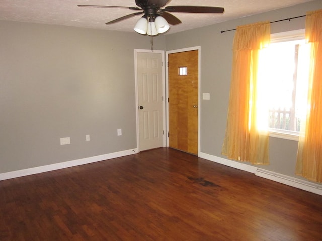 1404 E Washington St, Kirksville, MO 63501 - unfurnished room featuring ceiling fan, baseboards, and wood finished floors