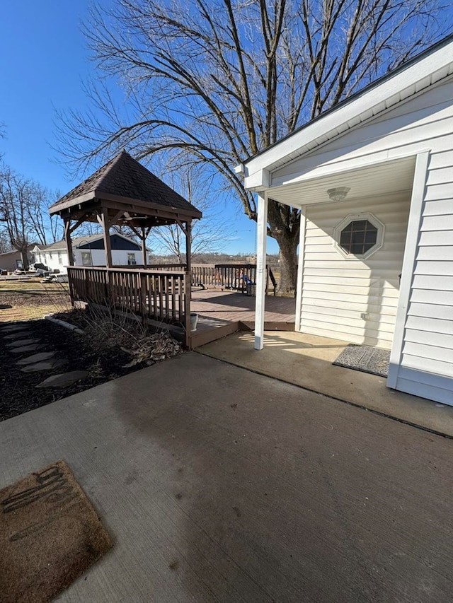 view of patio / terrace with a deck and a gazebo