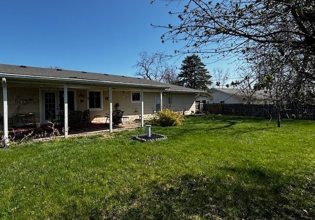 2 Center Dr, Kirksville, MO 63501 - back of property with a patio, fence, and a lawn