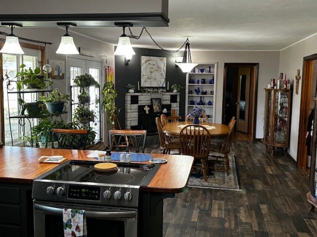 2 Center Dr, Kirksville, MO 63501 - kitchen with black / electric stove, a fireplace, wood counters, crown molding, and wood finished floors