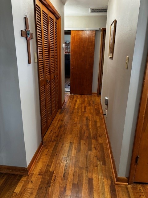 2 Center Dr, Kirksville, MO 63501 - corridor with visible vents, baseboards, and hardwood / wood-style floors
