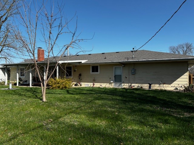 2 Center Dr, Kirksville, MO 63501 - rear view of property featuring a yard and a chimney