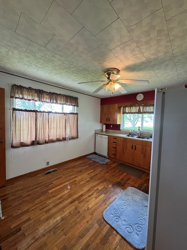 810 S W St, Green City, MO 63545 - kitchen featuring white appliances, healthy amount of natural light, a sink, and dark wood finished floors