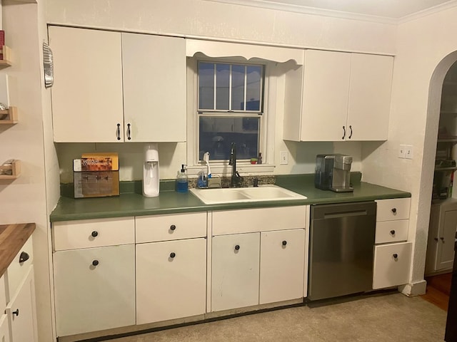 814 E Normal St, Kirksville, MO 63501 - kitchen featuring white cabinetry, crown molding, a sink, arched walkways, and dishwasher