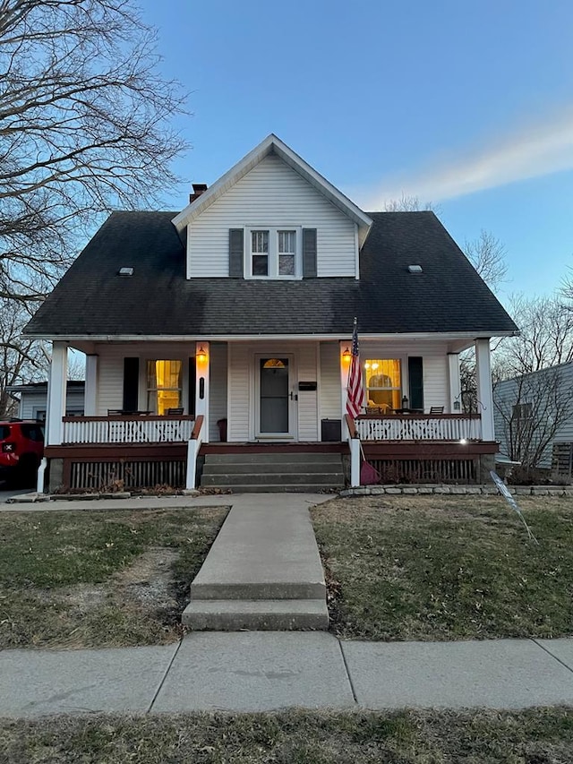 814 E Normal St, Kirksville, MO 63501 - farmhouse inspired home with a porch, a shingled roof, and a chimney