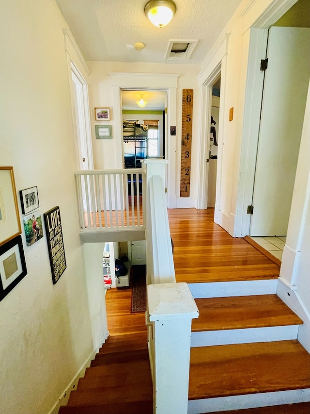 814 E Normal St, Kirksville, MO 63501 - staircase with wood finished floors and visible vents