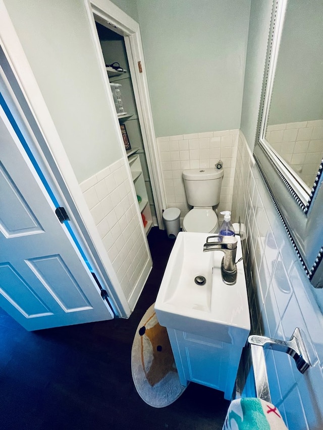 814 E Normal St, Kirksville, MO 63501 - bathroom featuring toilet, wainscoting, and tile walls