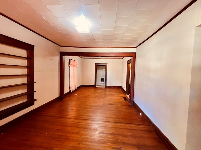 hall featuring wood-type flooring and ornamental molding