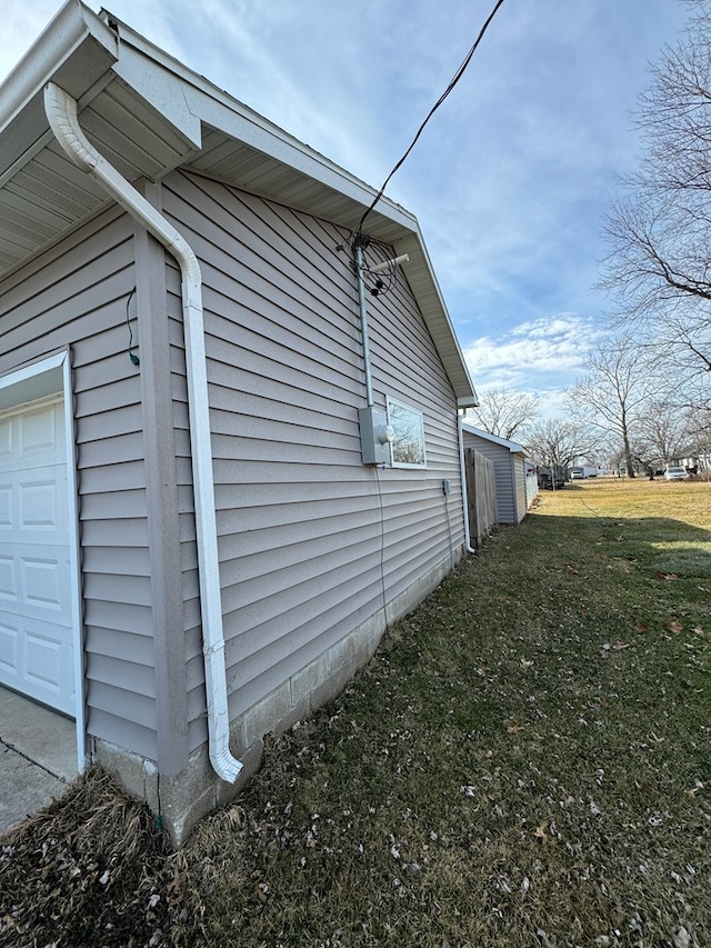 view of home's exterior with a yard