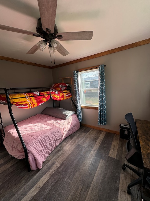 bedroom with ceiling fan, ornamental molding, and hardwood / wood-style floors