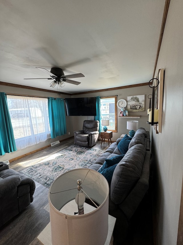 living room featuring crown molding, ceiling fan, plenty of natural light, and hardwood / wood-style floors