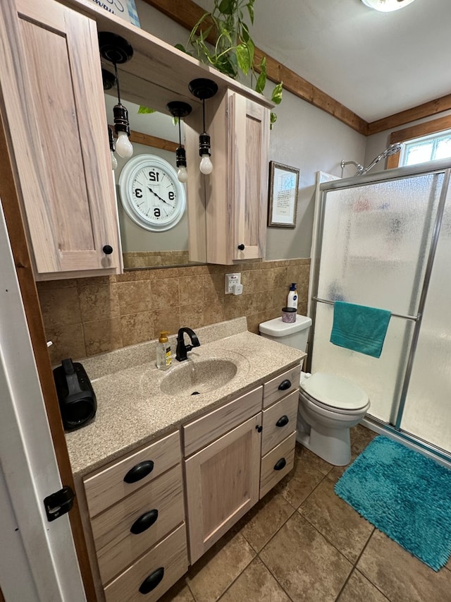 bathroom featuring tile patterned flooring, vanity, tile walls, and walk in shower