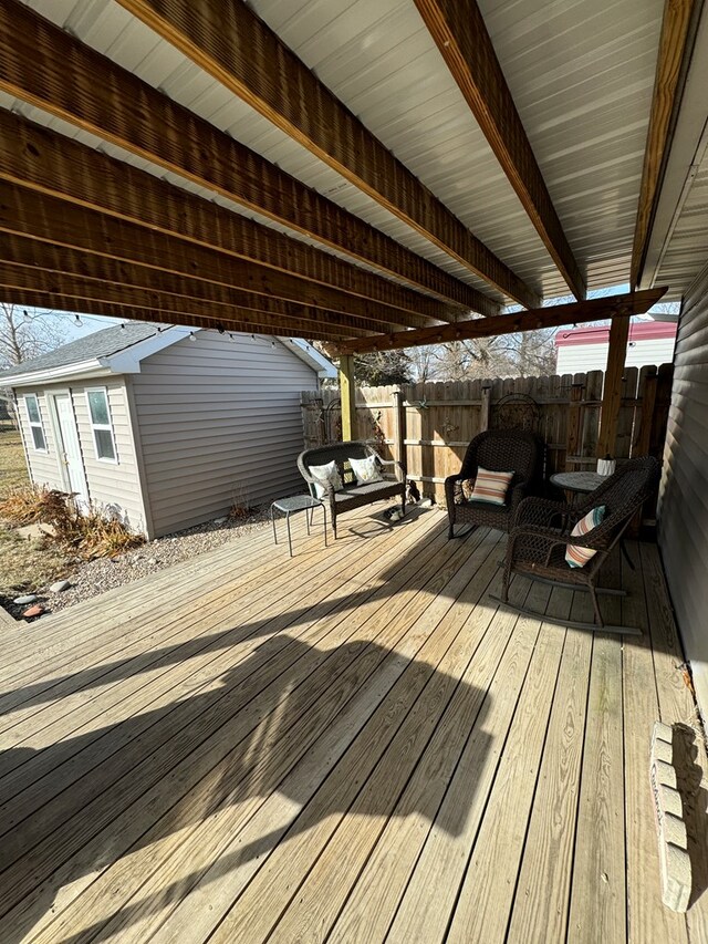 wooden deck with a grill