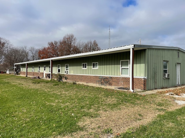 exterior space with cooling unit and a front yard