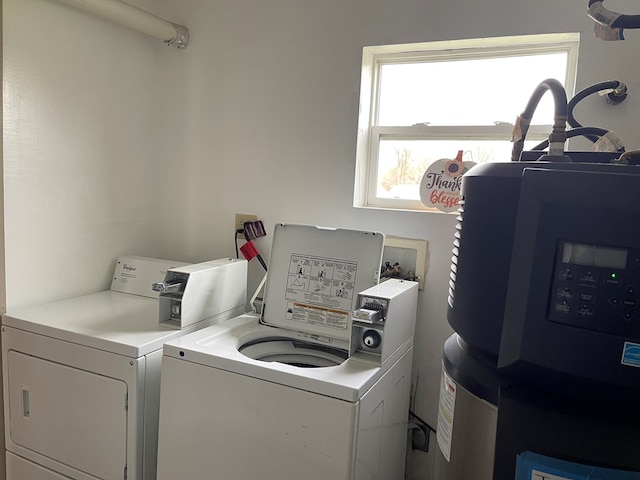 laundry area with independent washer and dryer