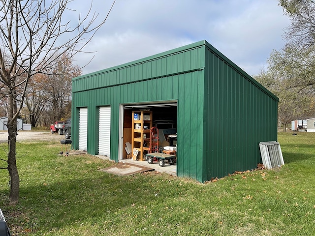 view of outbuilding with a lawn