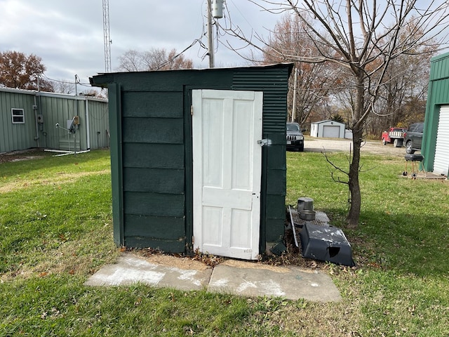 view of outbuilding with a lawn