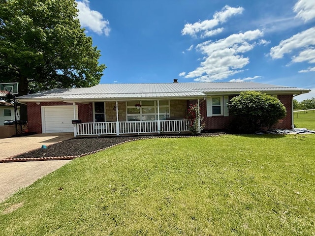 33 Overbrook Dr, Kirksville, MO 63501 - single story home with covered porch, a garage, a front yard, driveway, and brick siding