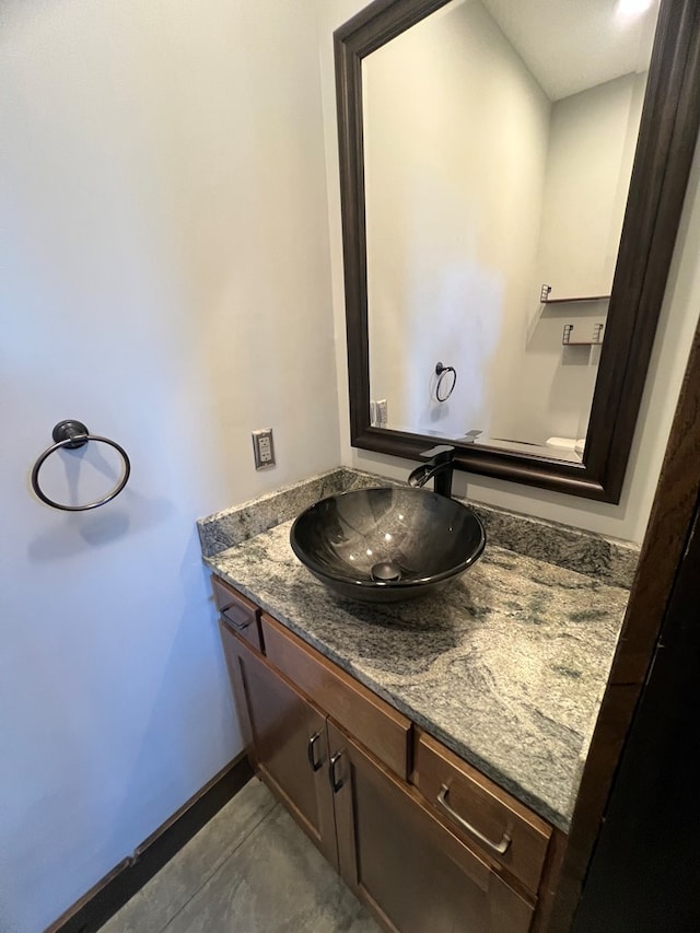 bathroom featuring vanity and baseboards